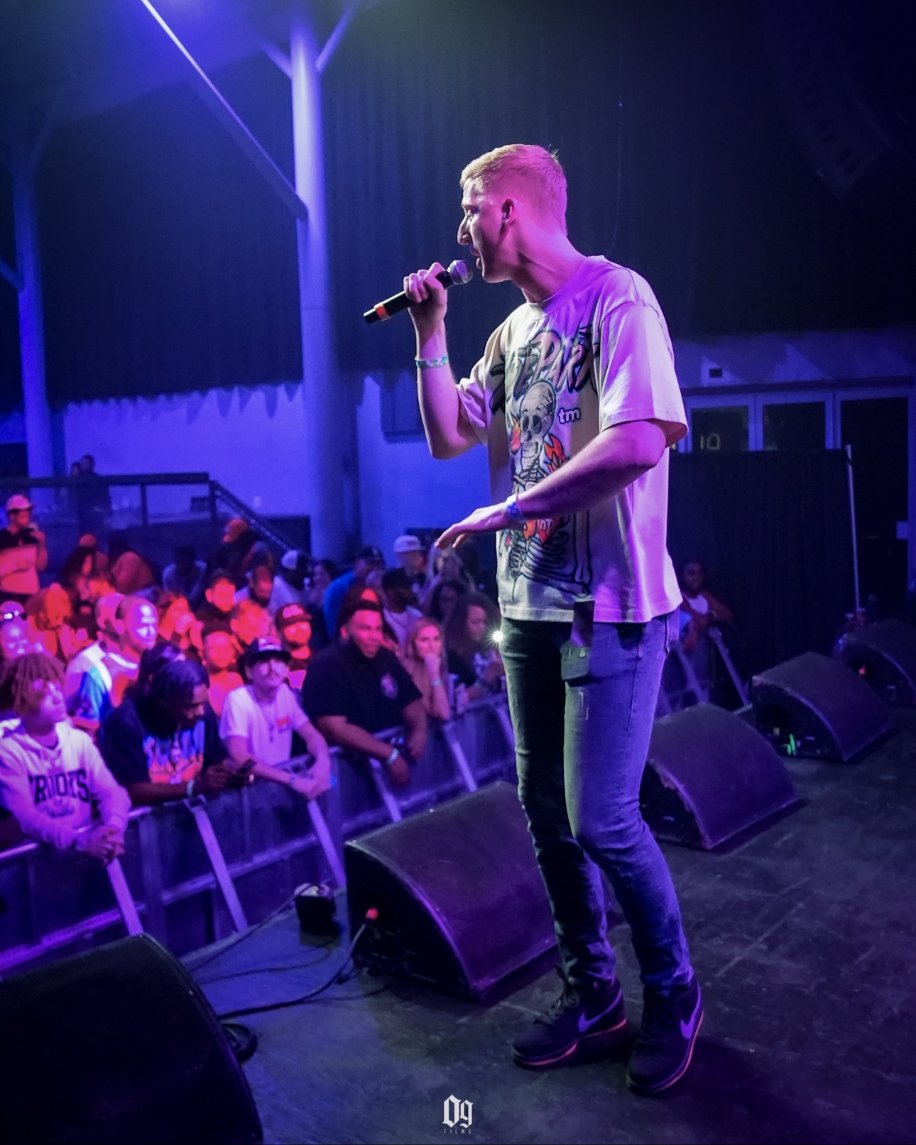 C-Hold performing with a microphone while opening for Boosie and Lil Keke